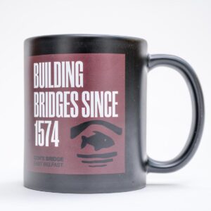 Con O'Neill mug with building bridges logo Irish gift for sale by Journey East bus and walking tours in Belfast Northern Ireland - photo 1230